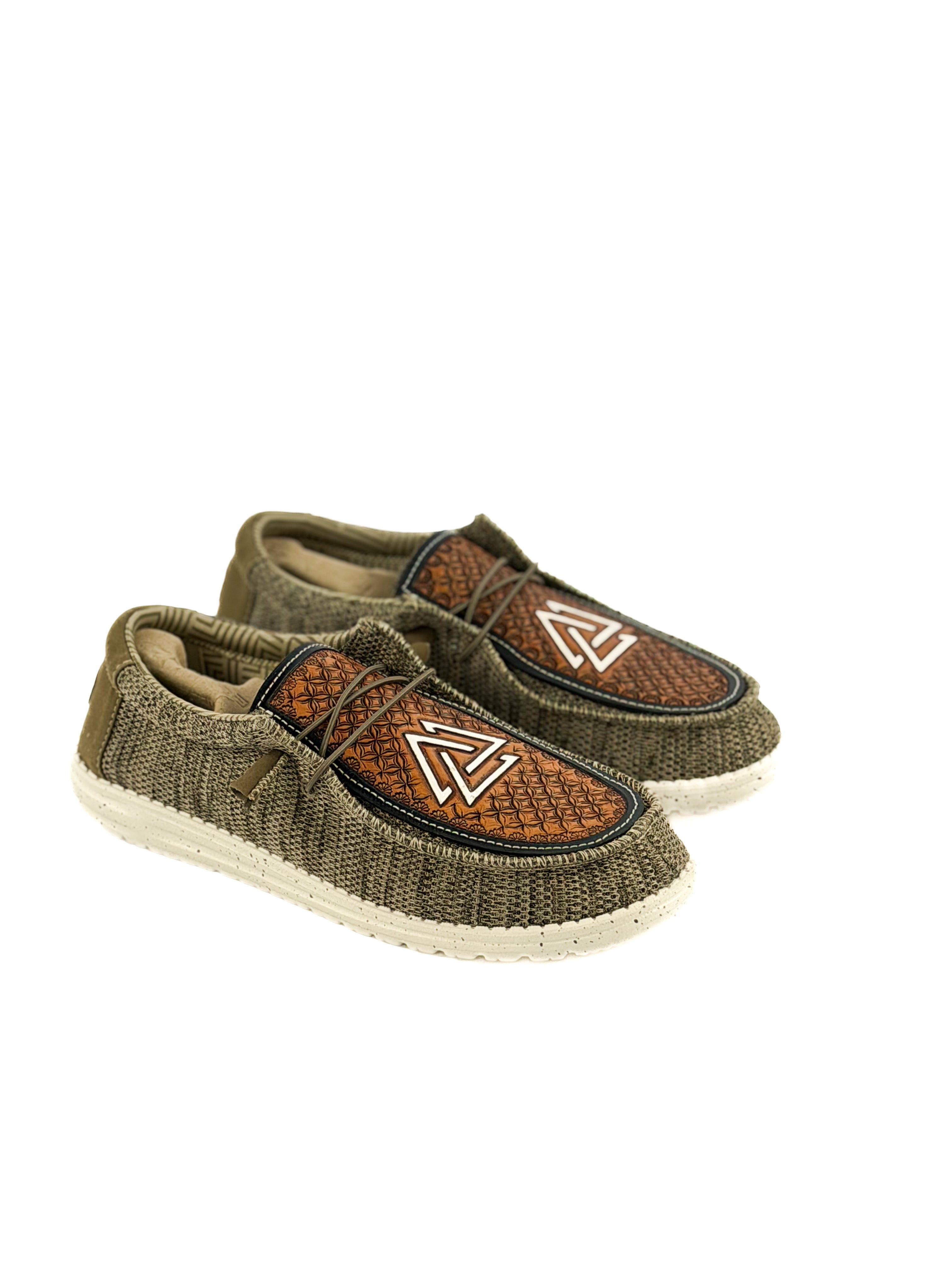 pair of olive green hey dudes hand tooled with piedreros logo