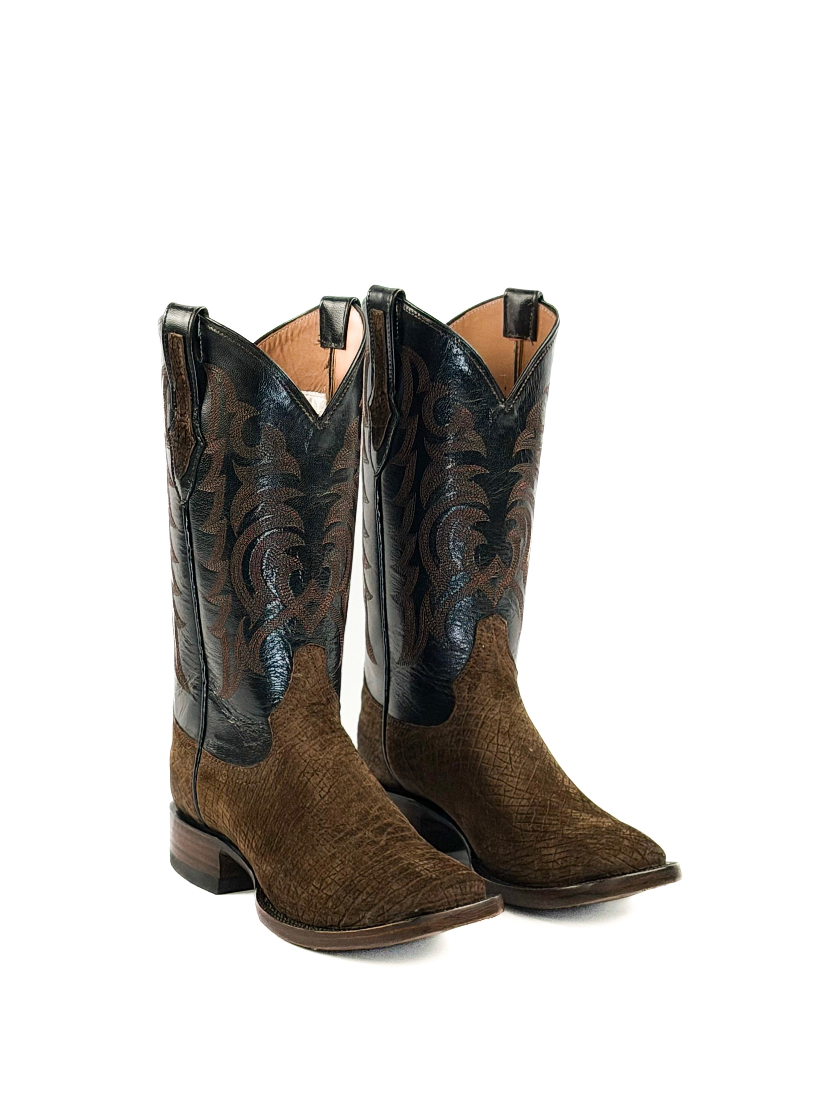 Pair of dark brown cowboy boots with black leather upper shafts