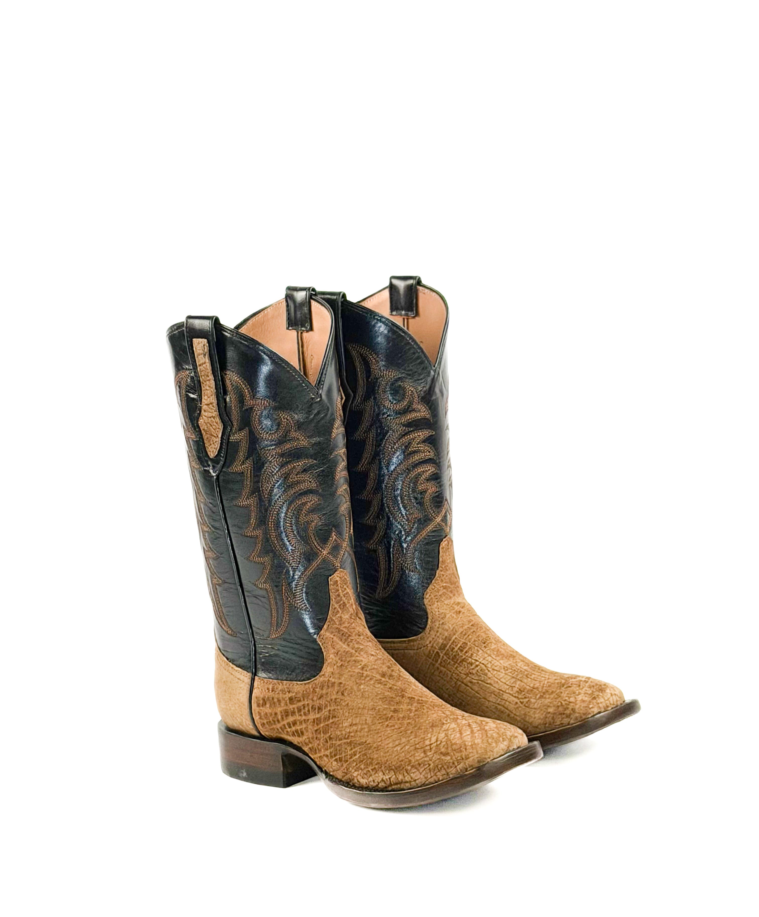 Pair of light brown cowboy boots with black upper shafts