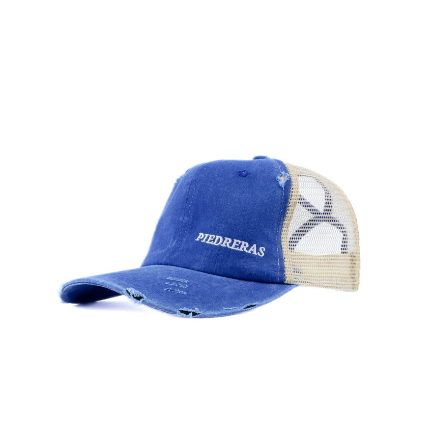Blue and beige cap with 'Piedreras' logo