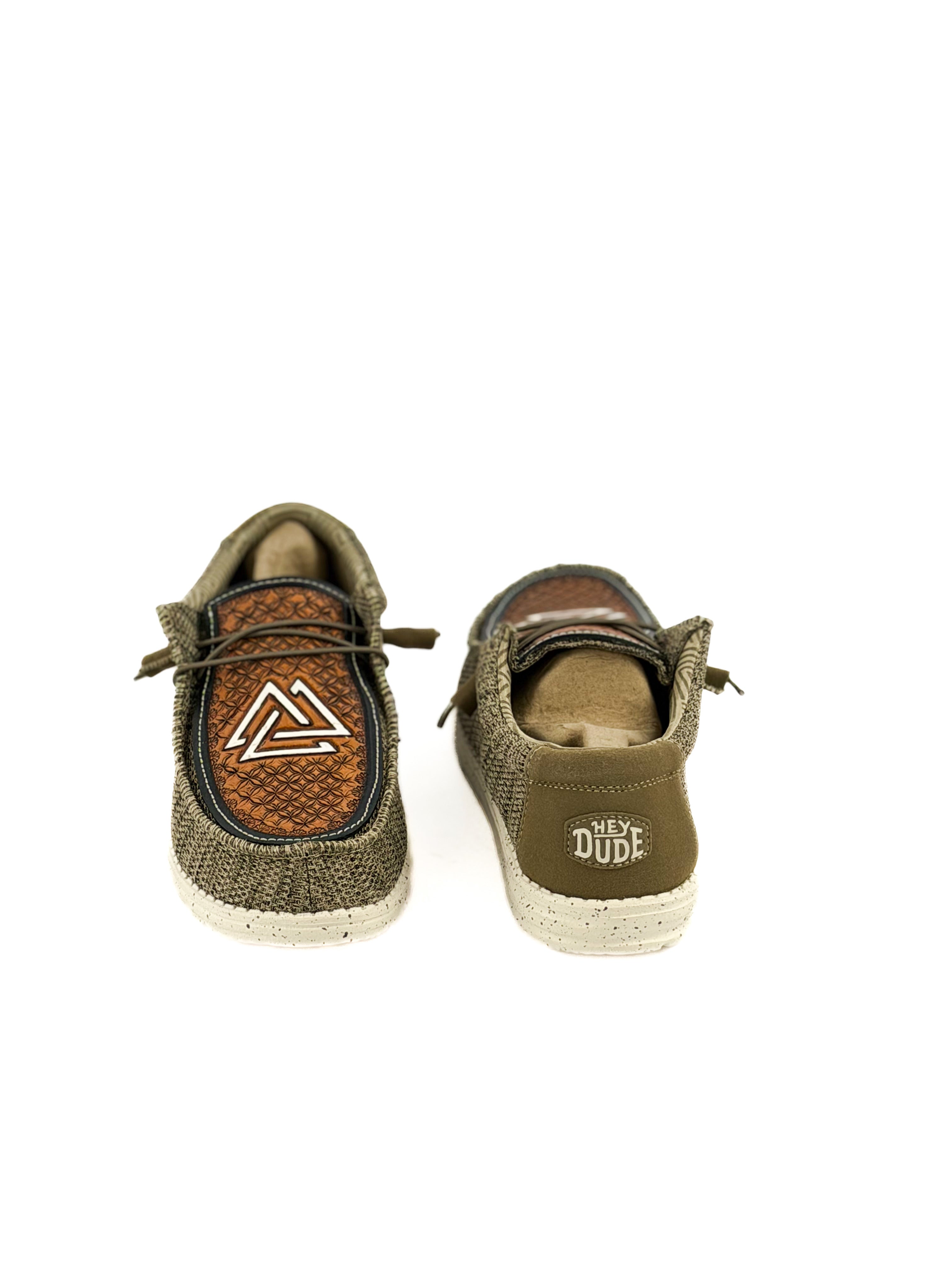pair of olive green hey dudes with hand tooled piedreros logo