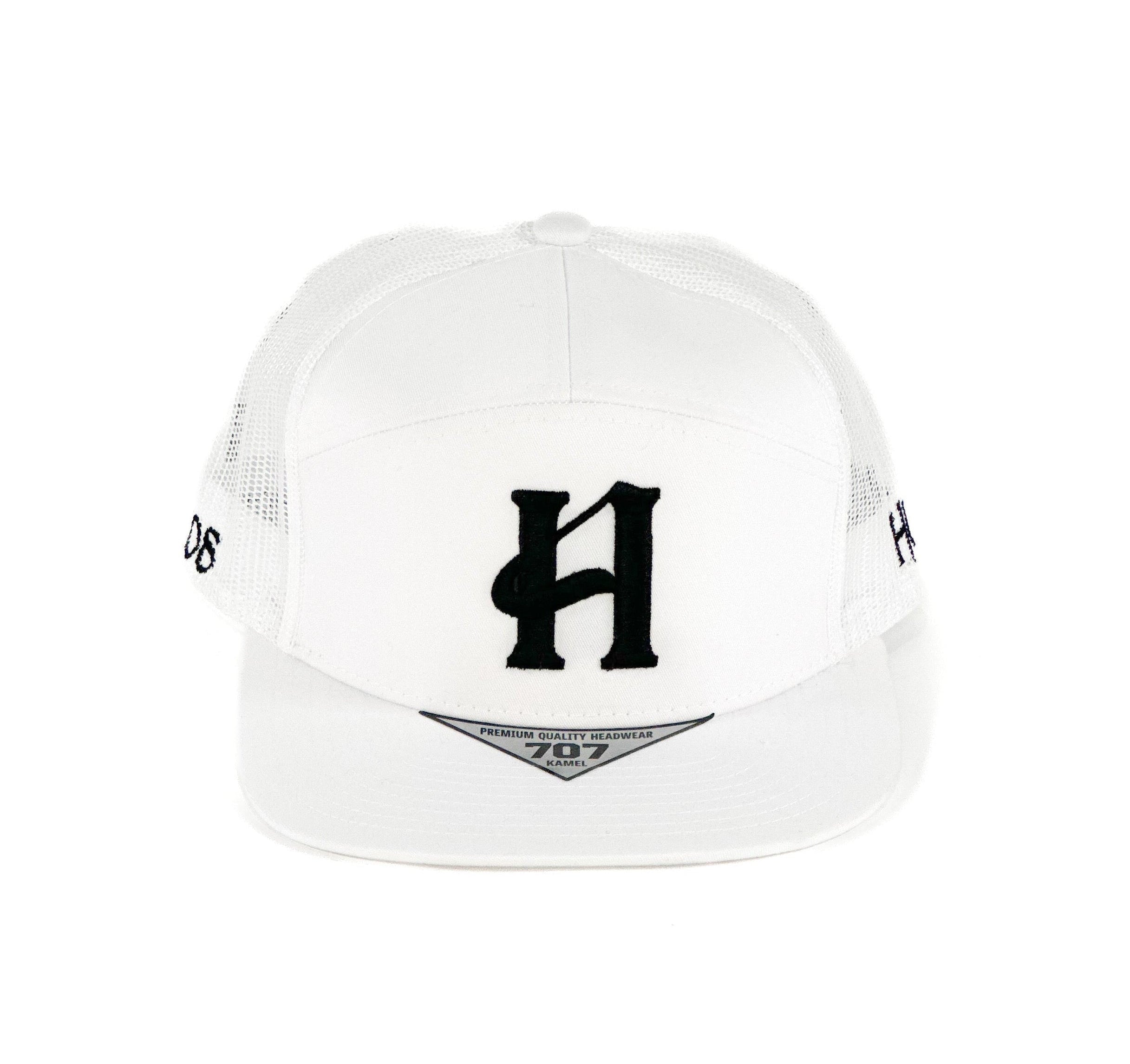 White cap with black cuadra piedreros logo
