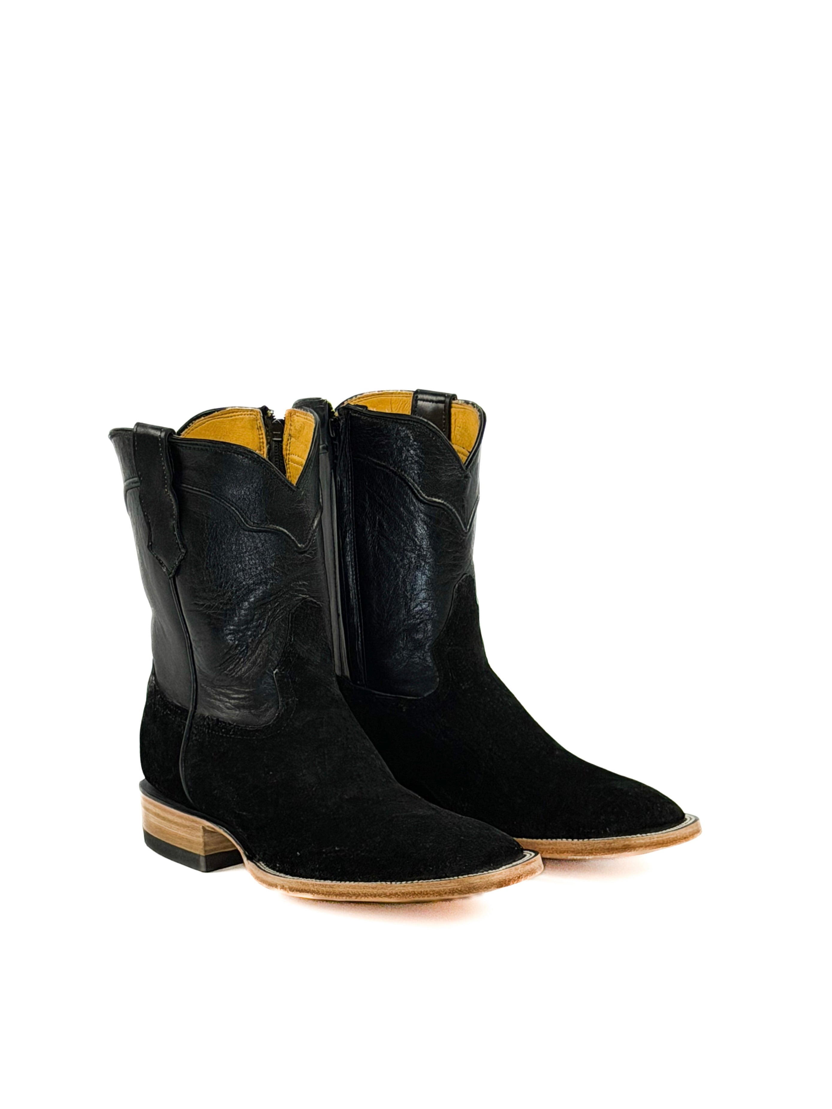Pair of black square toe cowboy boots with black upper shaft
