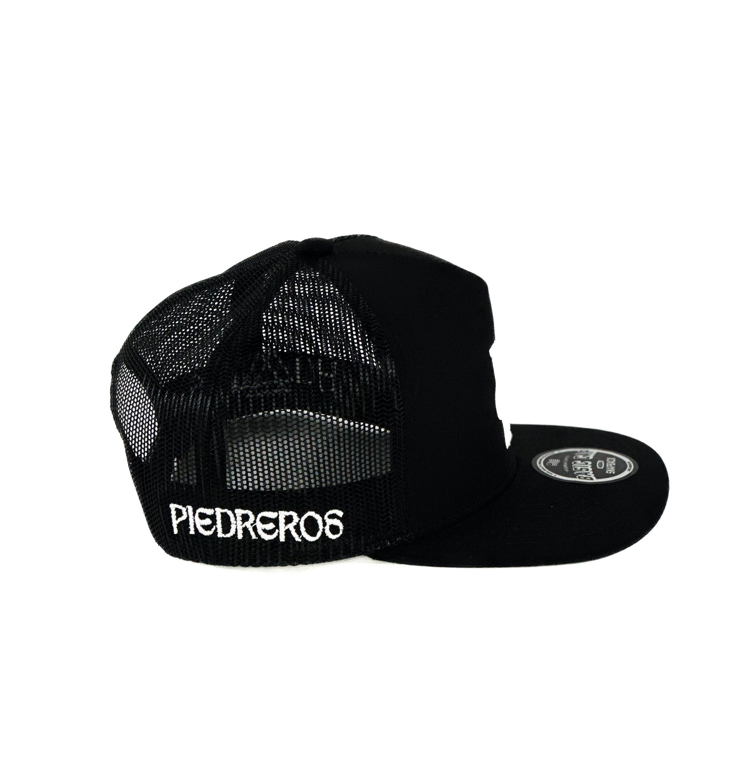 black mesh Cap with white humble cuadra piedreros logo 