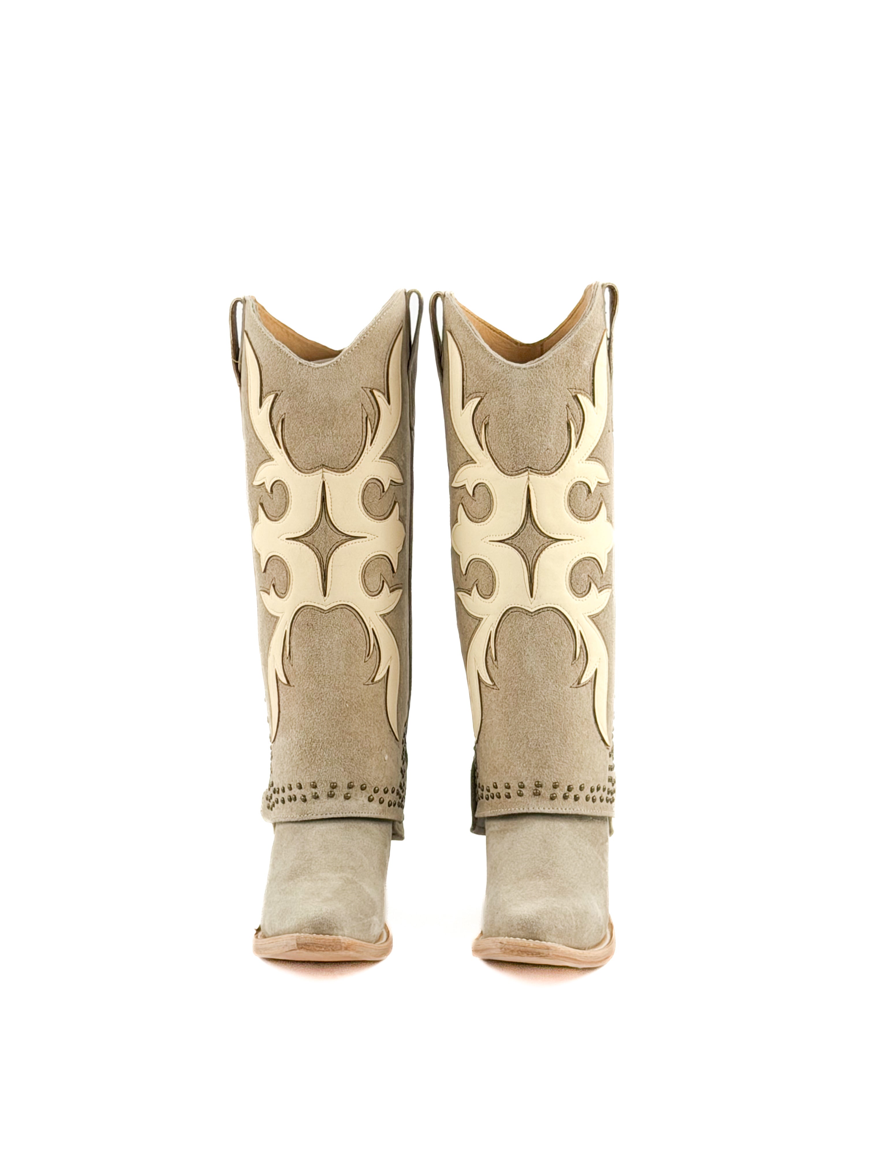 Pair of beige snip toe women’s boots with masquerade patterns and studded shaft