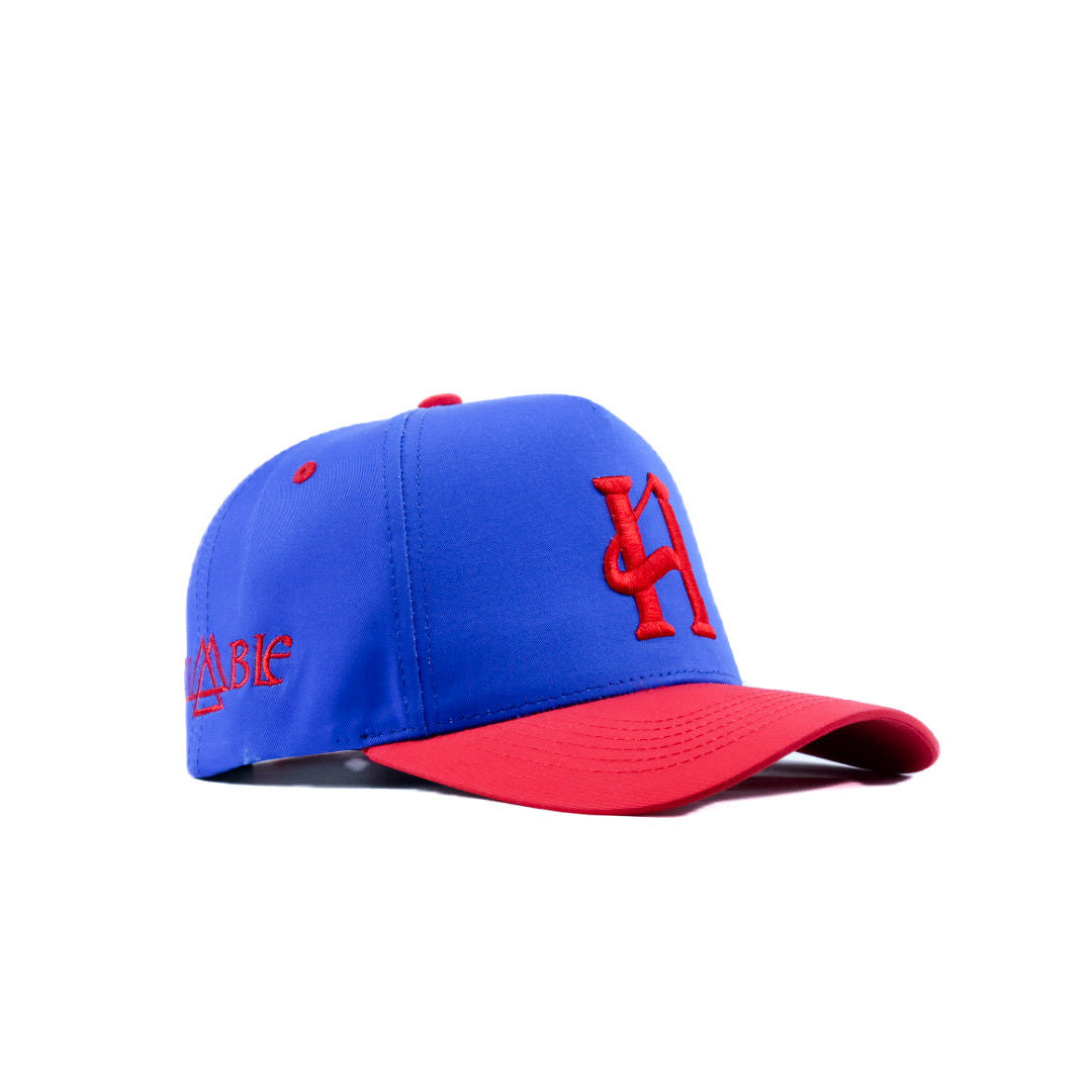Blue and red baseball cap with logo on a white background