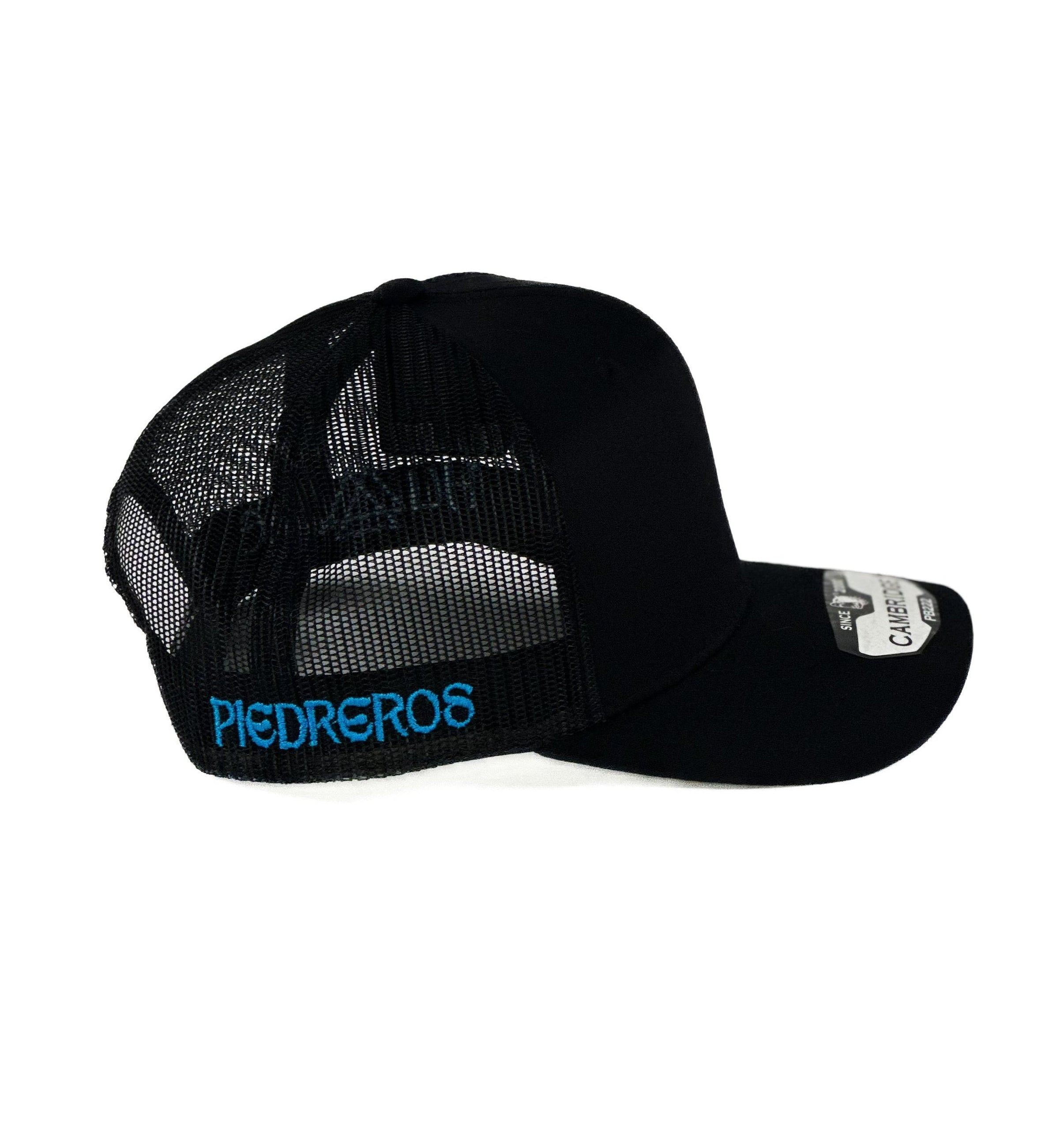 Black cap with a blue and white triangle cuadra piedreros logo