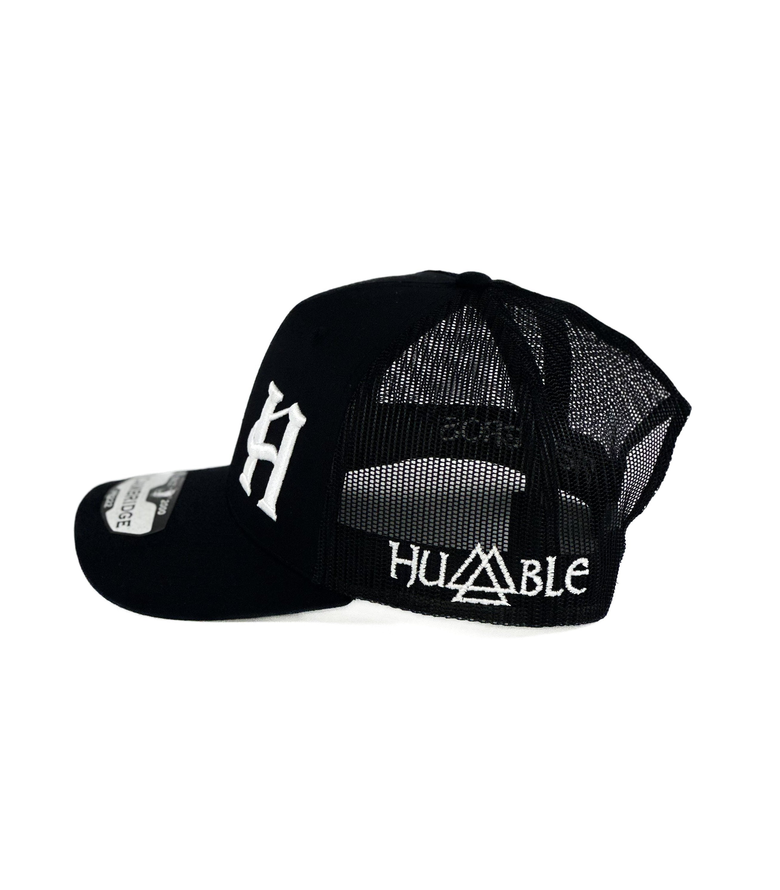 Black trucker Cap with white H cuadra piedreros logo