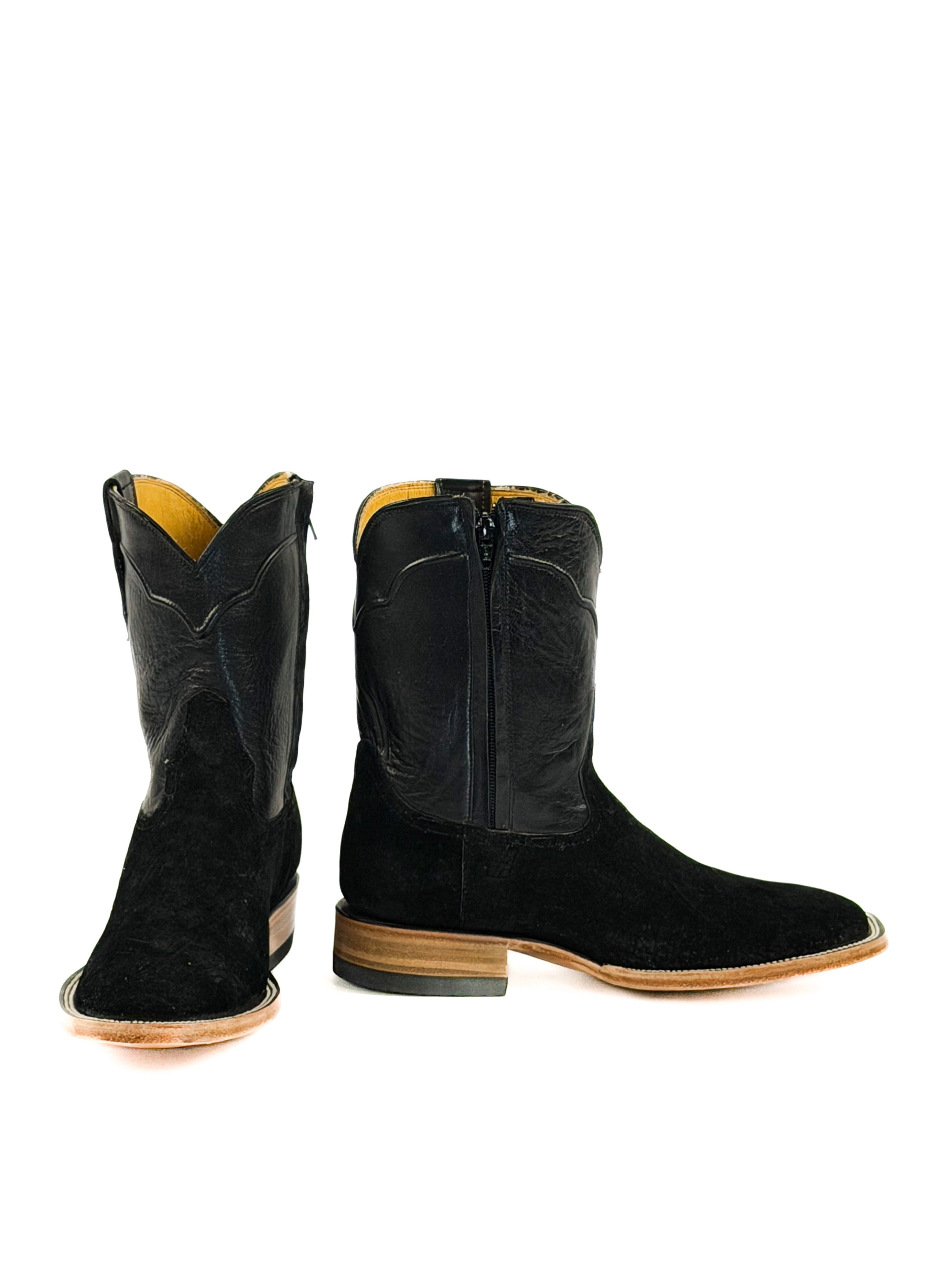 Pair of black square toe cowboy boots with a black shaft